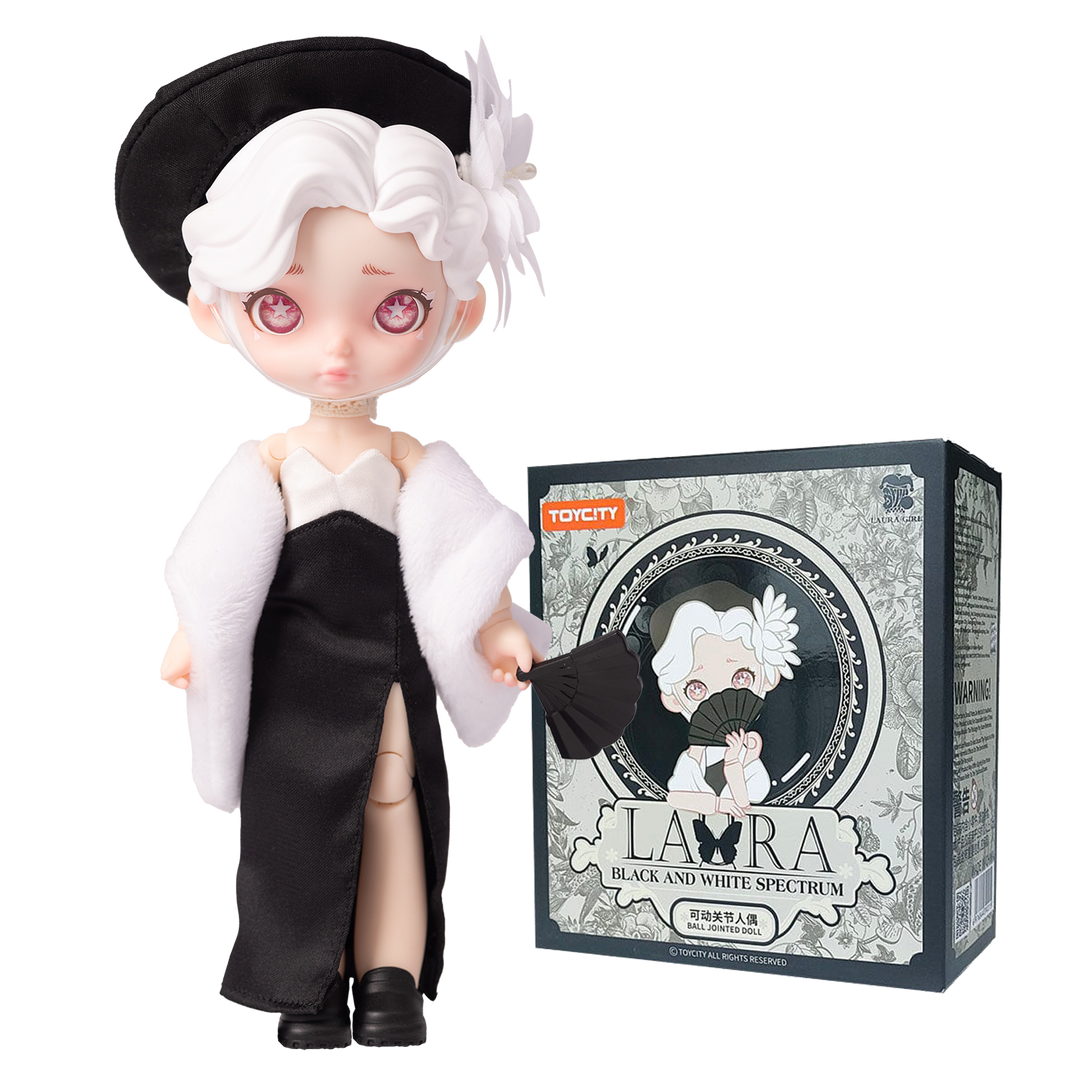 Animated character figurine with black and white outfit next to its packaging