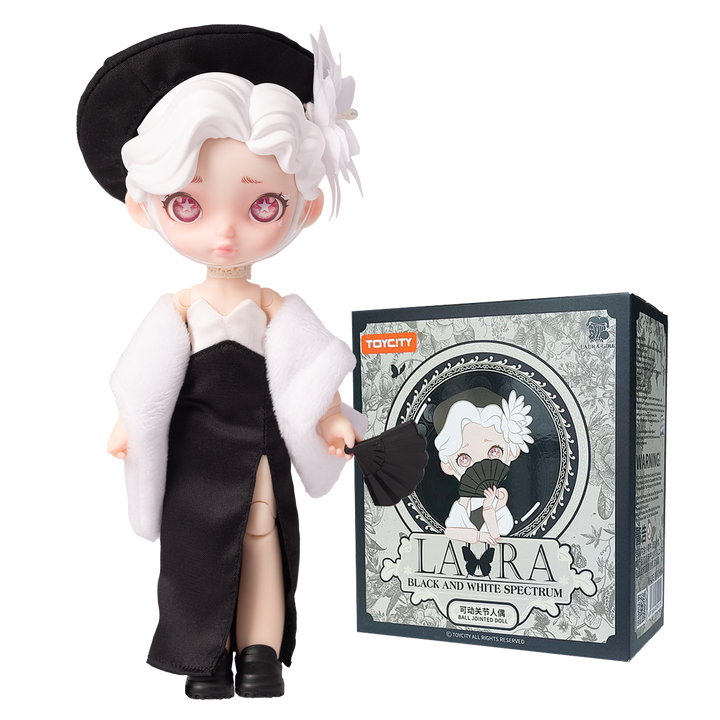 Animated character figurine with black and white outfit next to its packaging